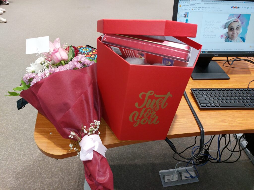 Red box with "Just for you" (contains chocolate but you can't really see it) and bouquet of flowers